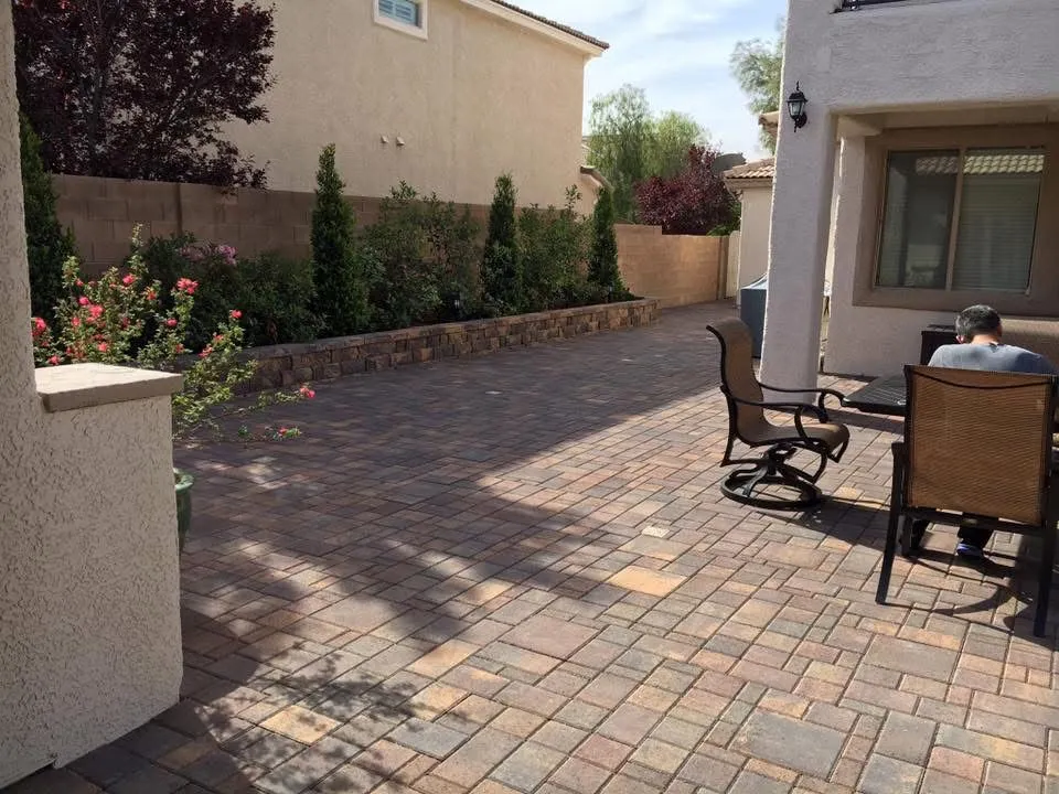 Cool light-toned paver patio in a Las Vegas backyard
