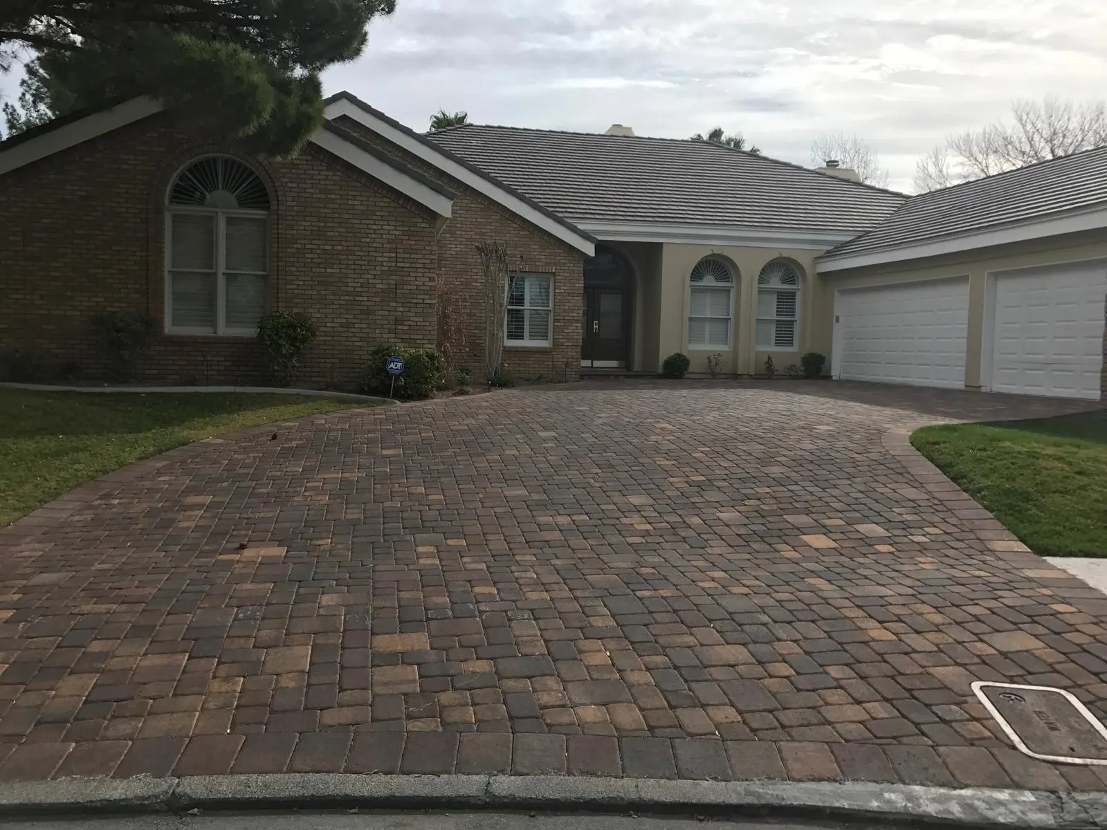 Paver driveway in Las Vegas replacing worn concrete with interlocking pavers