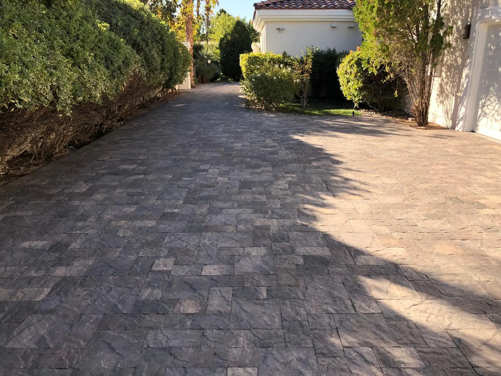 Paver driveway in Las Vegas framed by crisp soldier-course edging