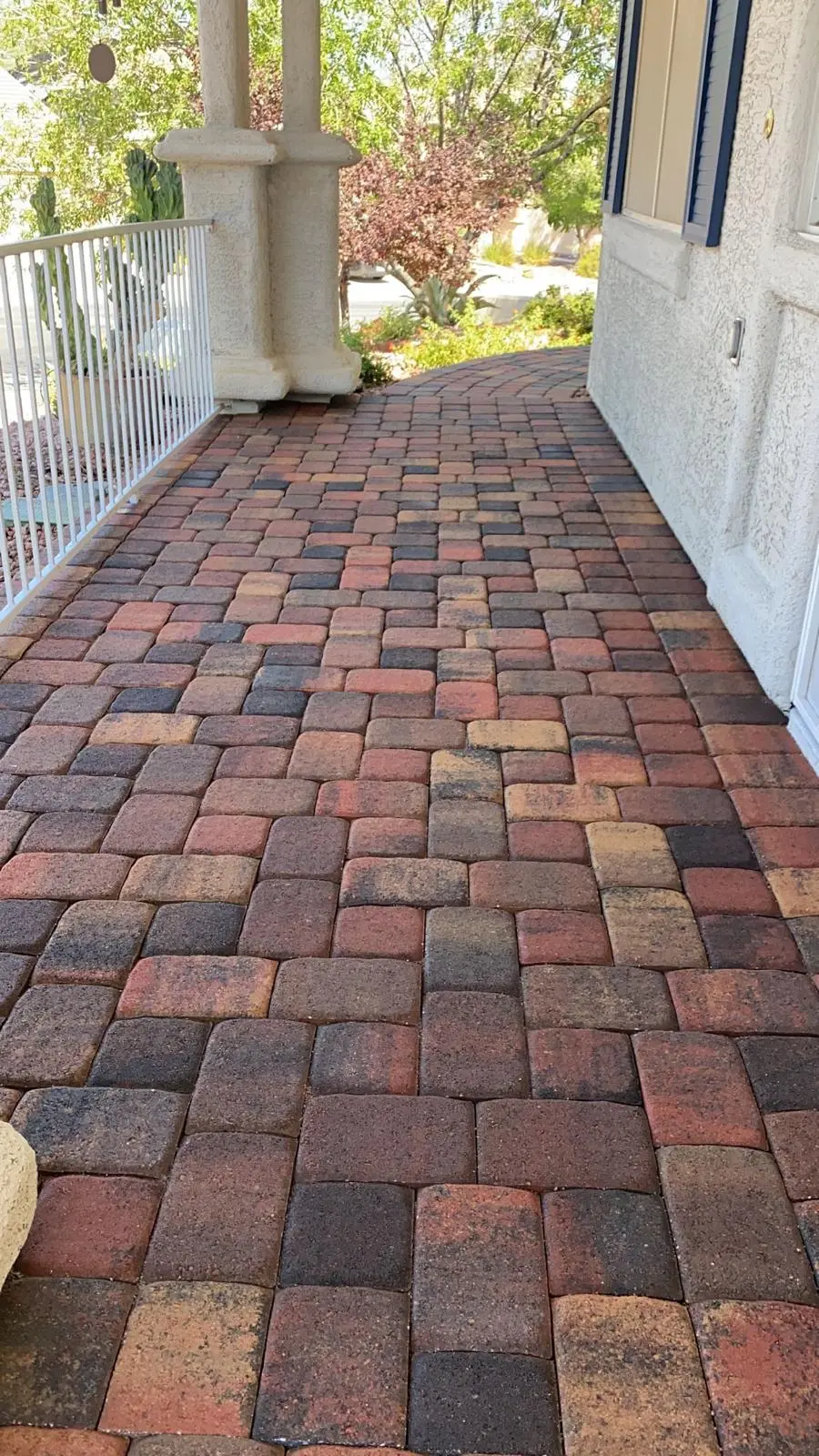 Paver entryway in Las Vegas leading to a covered front porch