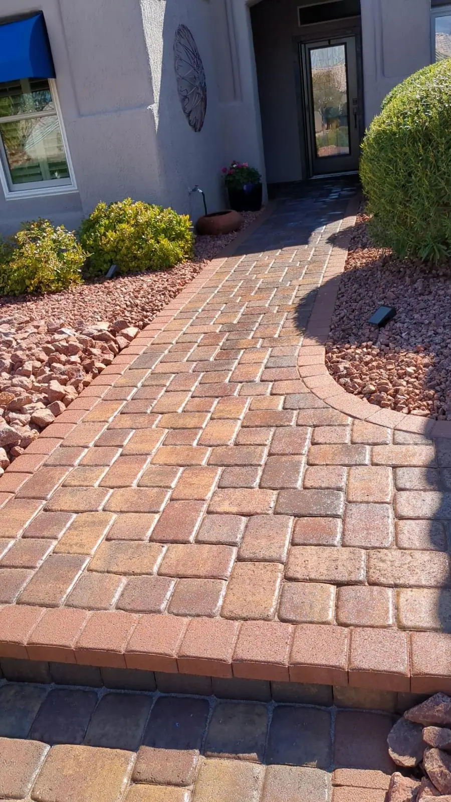 Paver entryway in Las Vegas framed by desert landscaping