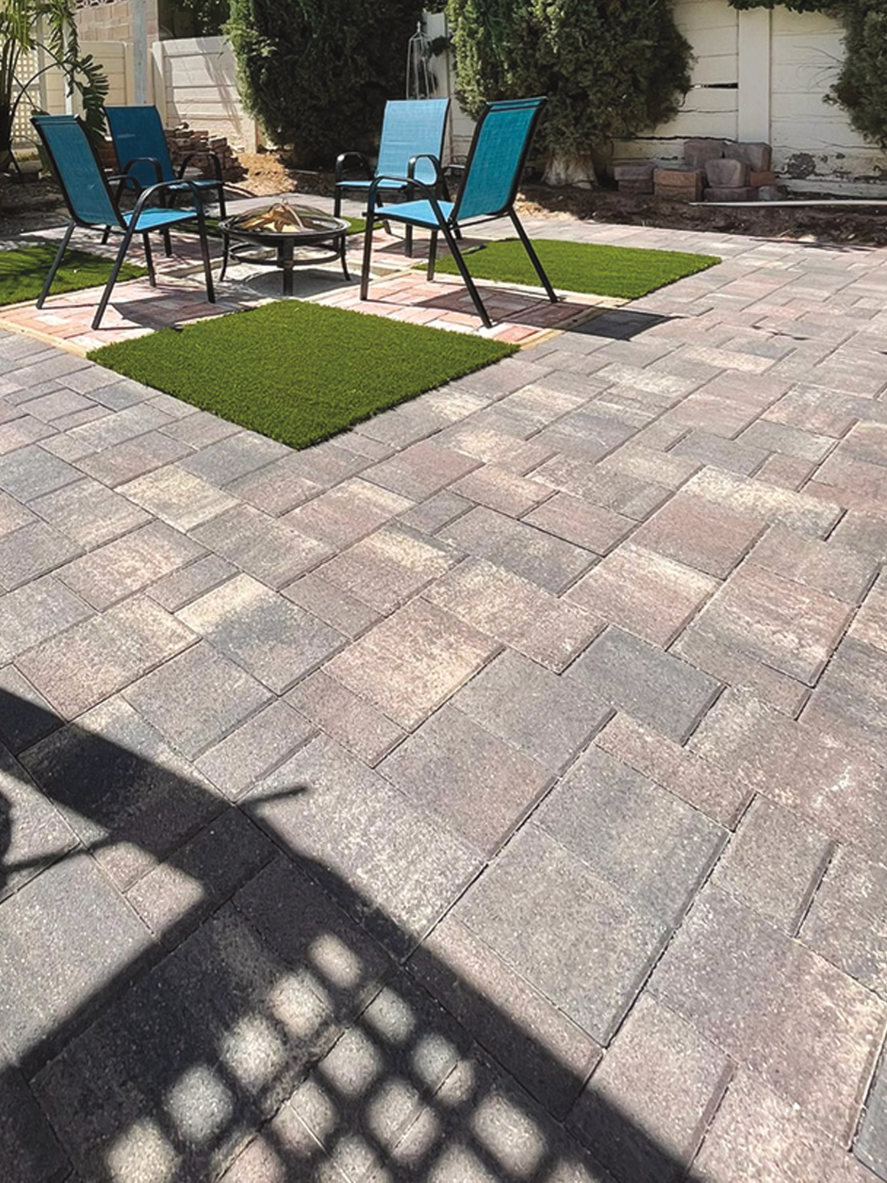 Paver patio in Las Vegas with a custom fire feature and seating