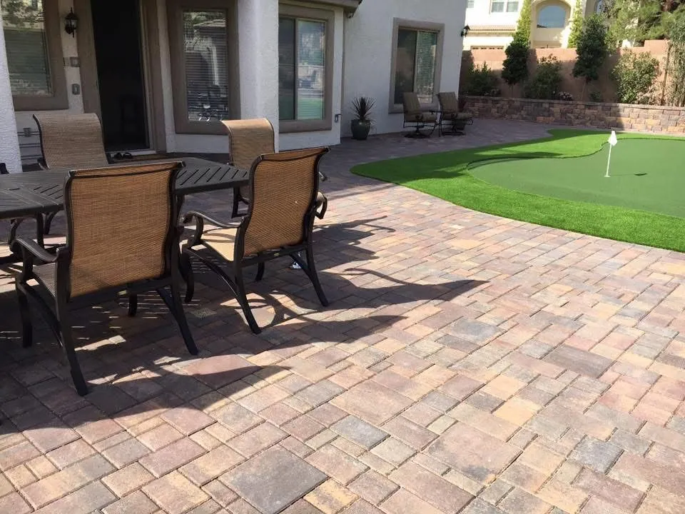 Paver patio in Las Vegas under a shaded pergola lounge