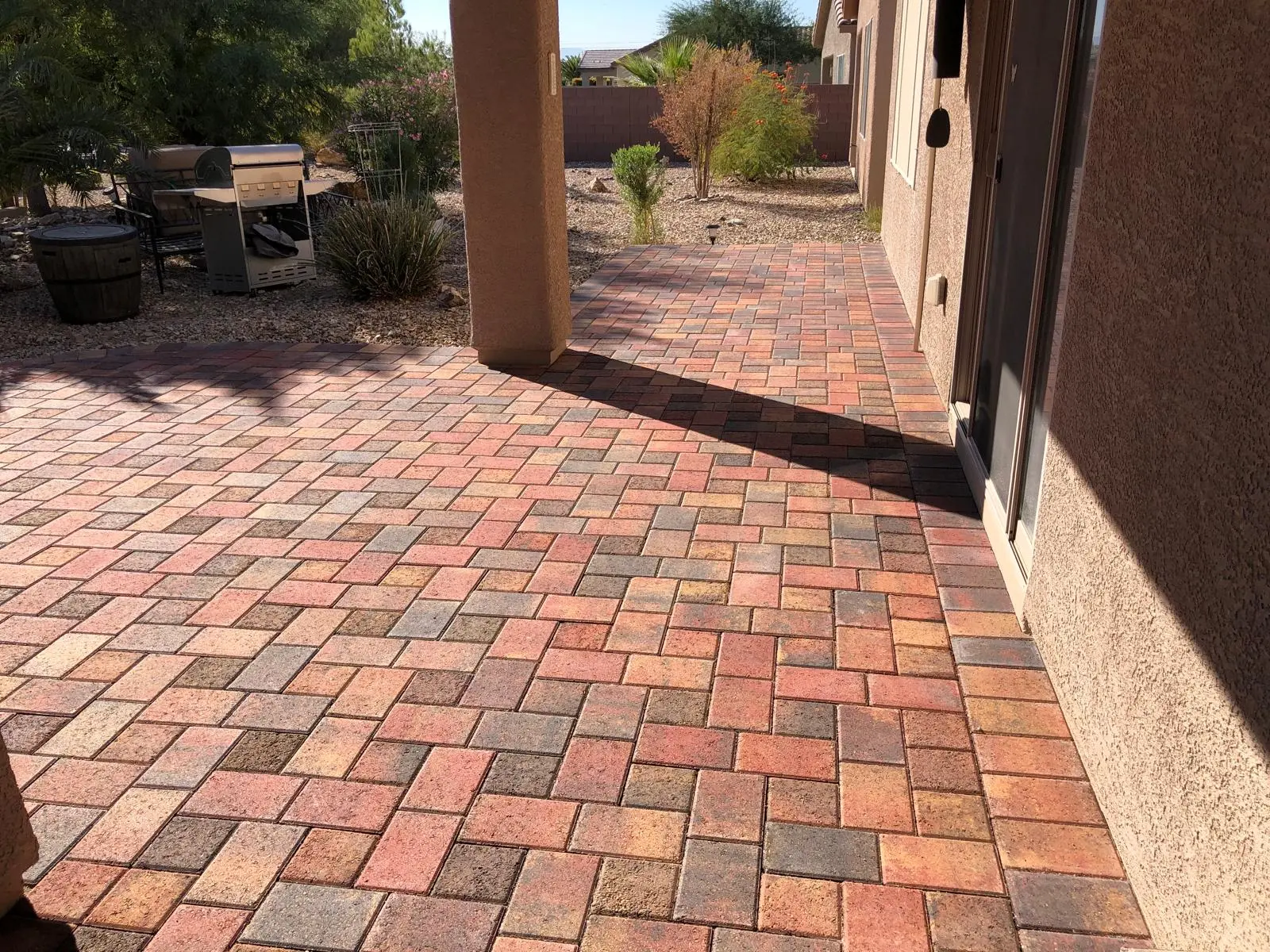 Paver patio in Las Vegas with a custom fire feature and seating