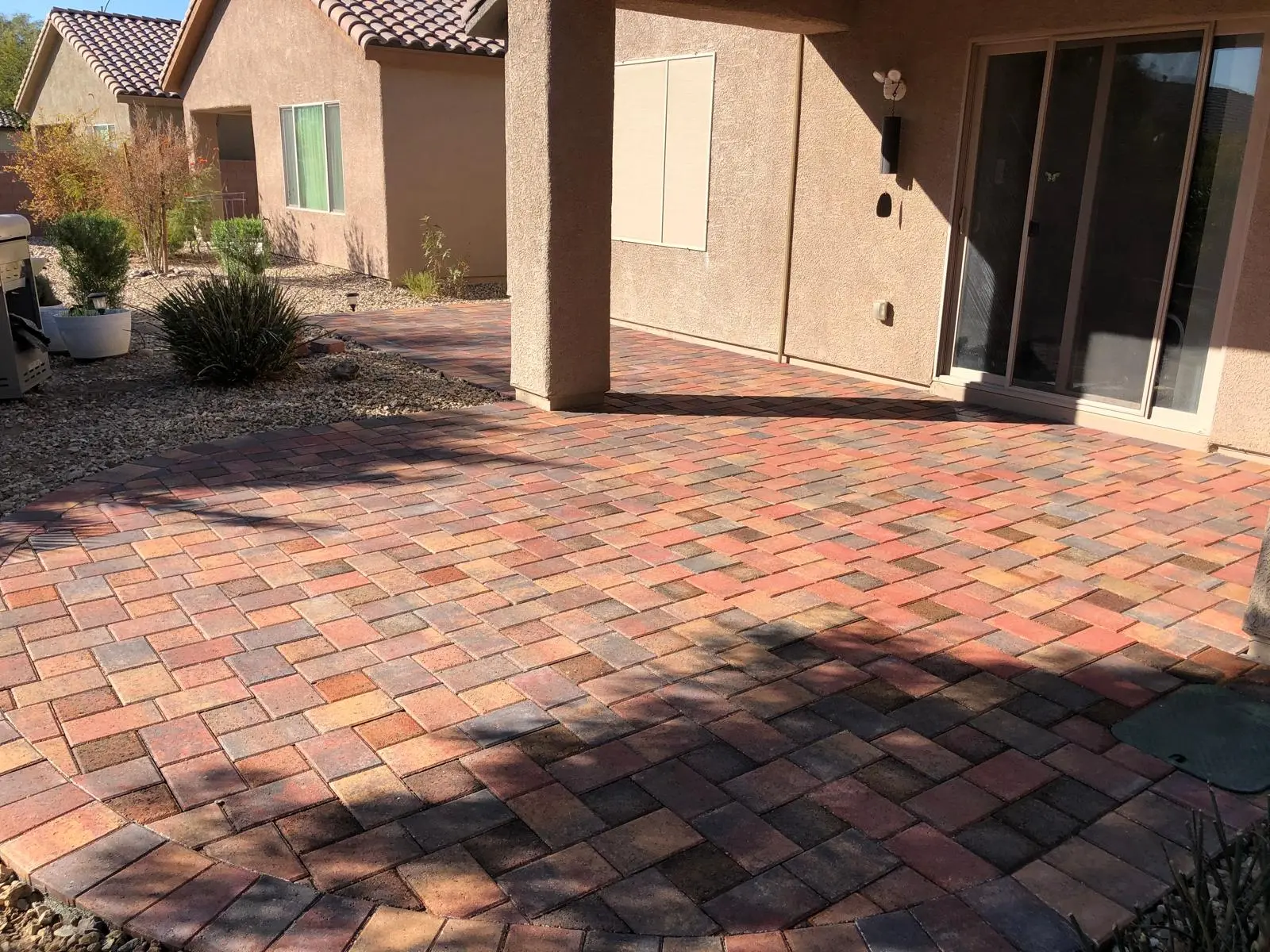 Paver patio in Las Vegas under a shaded pergola lounge