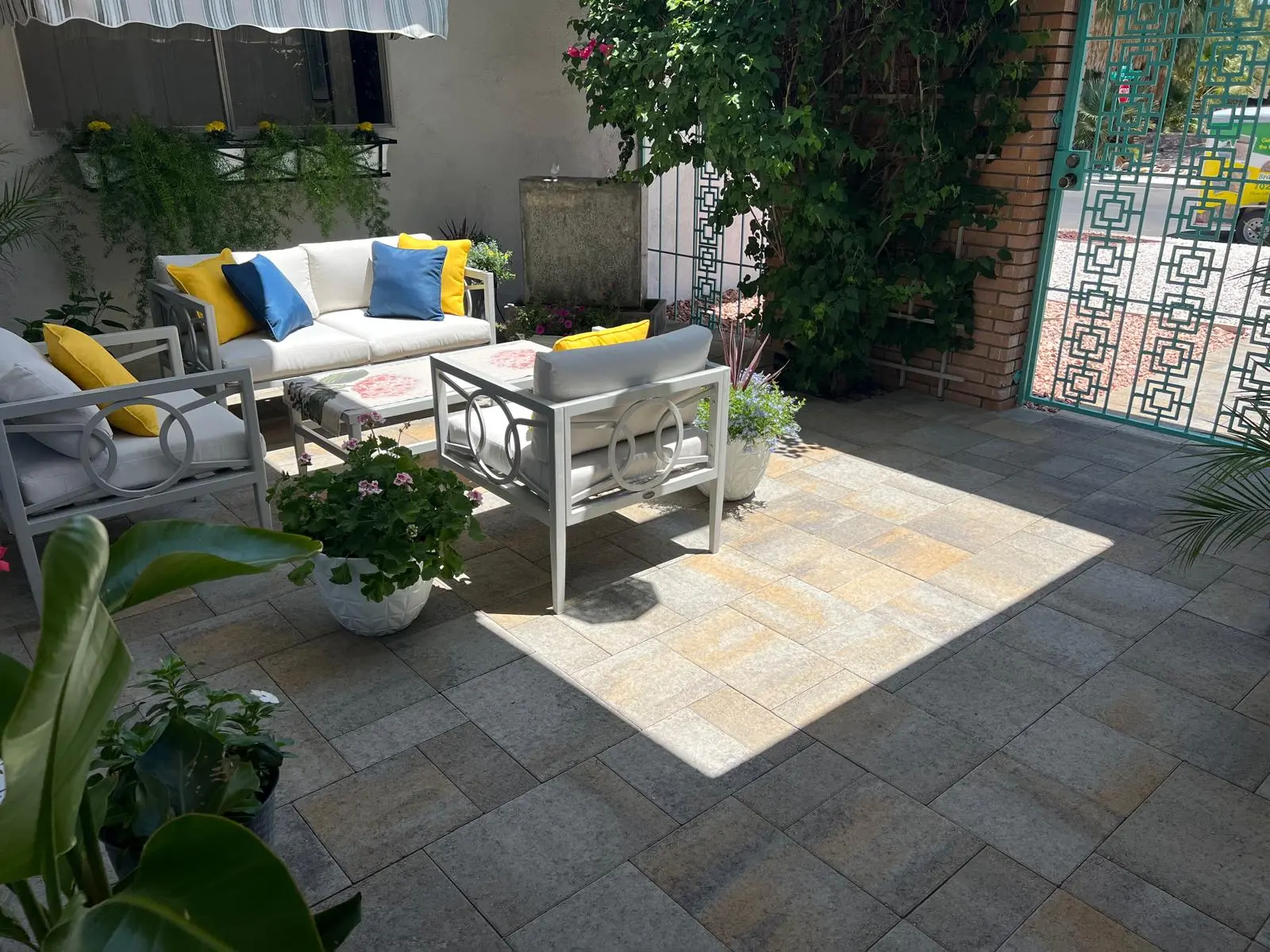 Paver patio in Las Vegas paired with lush desert landscaping