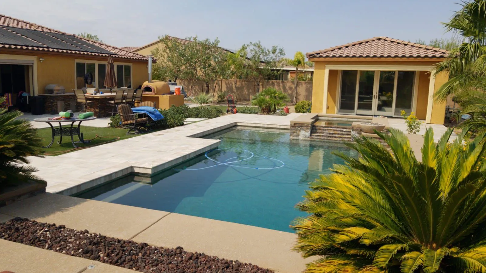 Paver pool deck in Las Vegas surrounding a resort-style backyard pool