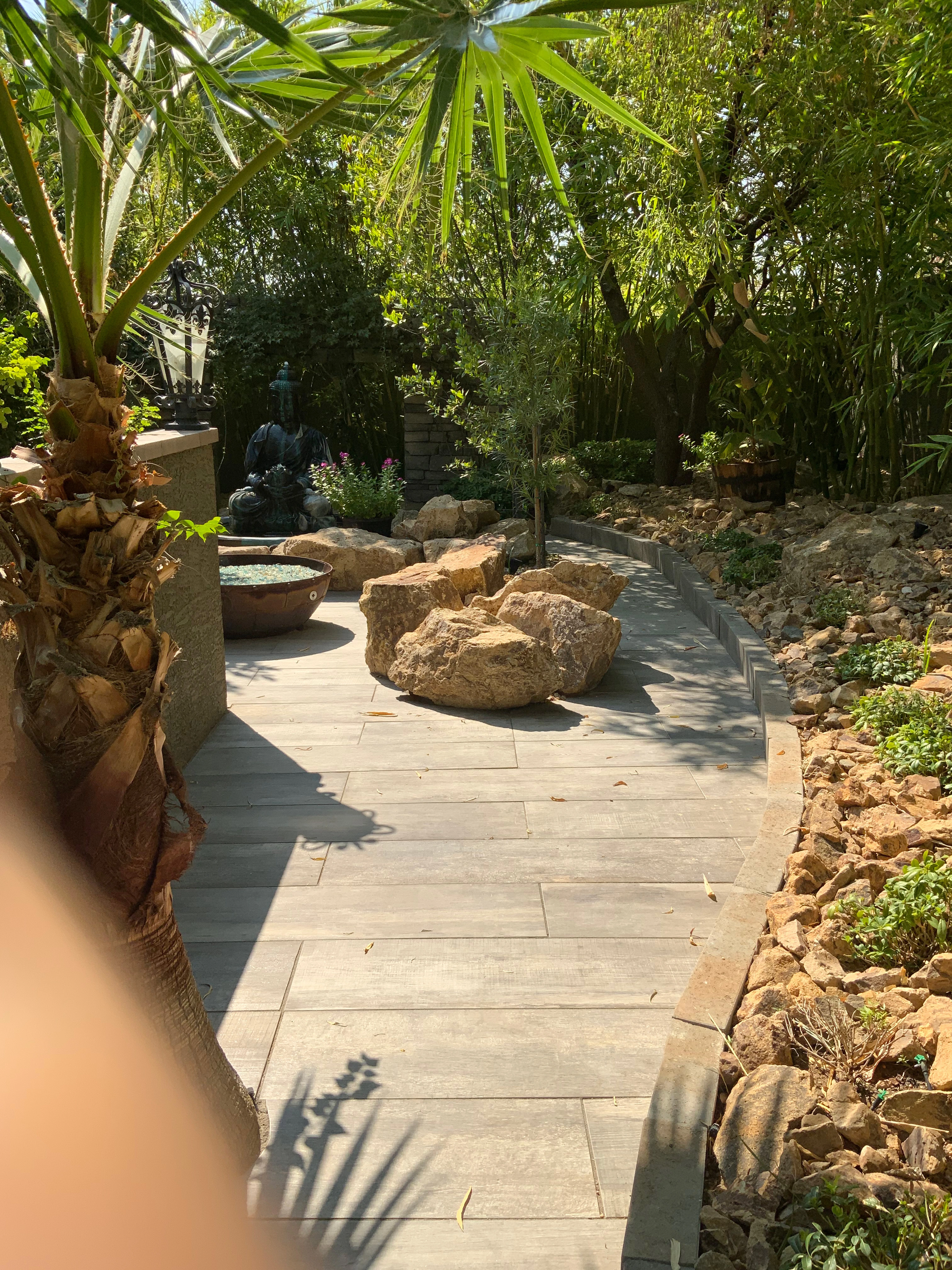 Paver walkway in Las Vegas winding through a desert garden
