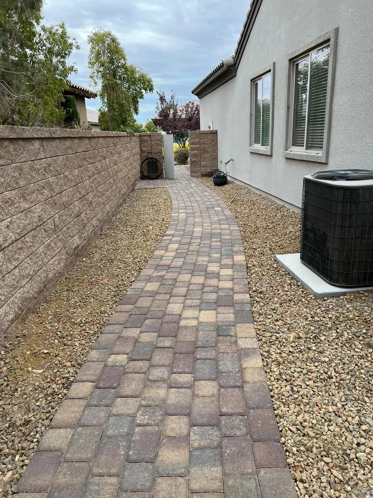 Paver walkway in Las Vegas through a low-water desert landscape